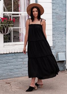 DETAILS Steal the show wherever you go in this black maxi! The Happy Hour Tiered Maxi features an adjustable tie shoulder straps and a square elasticize bust on a flowy gauzy fabrication finished on a flawless tiered ruffled maxi length! This eye-catching classic black maxi dress can be styled with a dark neutral heel for a an easy breezy summer look! Maxi Length Bump Friendly Tiered Details Gauzy Fabrication Hand Wash Cold Ruffles Elasticized Bust Adjustable Tie Shoulder Straps Elasticized Bust Neutral Heels, Tiered Midi Dress, Black Midi, Tiered Maxi Dress, Easy Breezy, Black Maxi, The Happy, Black Maxi Dress, Pet Hair