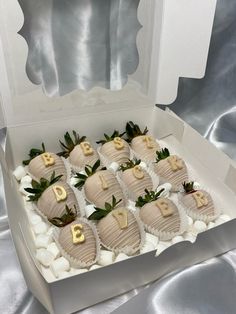 a white box filled with chocolate covered strawberries