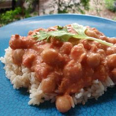 a blue plate topped with rice and beans