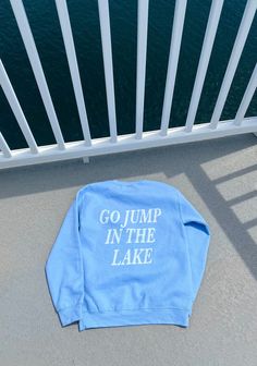 The perfect crewneck for a lake day. These garments are made from polyester and cotton. This combination helps designs come out looking beautiful. The collar is ribbed knit, so it retains its shape even after washing. There are no itchy side seams on these sweaters. The crew comes in four colors light blue, sand, navy and light pink. .: 50% cotton, 50% polyester .: Medium-heavy fabric  .: Loose fit .: Sewn-in label .: Runs true to size Outdoor Blue Sweatshirt With Letter Print, Outdoor Crew Neck Sweatshirt With Logo Print, Outdoor Logo Print Crew Neck Sweatshirt, Weekend Getaway Cotton Crew Neck Top, Relaxed Fit Crew Neck Top For Weekend Getaway, Blue Crew Neck Sweatshirt With Lettering, Summer Lake Outfits, Clothes Summer Aesthetic, Boat Outfits