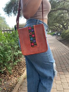 This beautiful handbag with adjustable handle is handmade by Mexican Artisans. Pair the bag with your favorite dress or jeans - it will instantly liven up any outfit! Hand-stitched Crossbody Bags For Everyday Use, Multicolor Embroidered Bags For Everyday Spring Use, Hand-stitched Crossbody Shoulder Bag For Daily Use, Multicolor Embroidery Crossbody Shoulder Bag, Hand-stitched Crossbody Shoulder Bag, Daily Use Hand-stitched Crossbody Shoulder Bag, Casual Brown Embroidered Bag, Rectangular Embroidered Bag For On-the-go, Embroidered Leather Satchel Bag