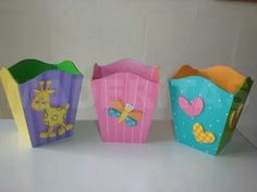 three small boxes with different designs on them