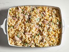 a casserole dish filled with pasta and meat