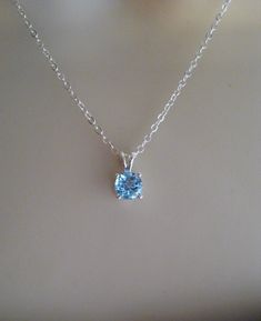 Similar items: ALLDANAE.etsy.com Please read my shop policies before ordering: https://www.etsy.com/shop/AllDanae#policies A beautiful blue topaz gem strung on a sparkling sterling silver chain. The sky blue color of the topaz is exquisite. It measures just 6mm (about 1/4 inch) in diameter, and has excellent clarity and sparkle. The necklace length is customizable. Choose your perfect size from the drop down menu. ♥ Please note: my jewelry is not intended for infants or young children. Necklaces Blue Topaz Pendant Necklace, Blue Gemstone Necklace, December Birthstone Jewelry, Natural Gemstone Necklace, Blue Topaz Necklace, Blue Topaz Pendant, Topaz Pendant, Topaz Necklace, Gemstone Necklace Pendant