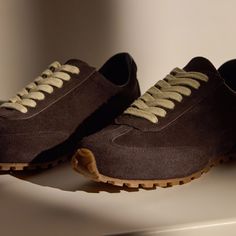 Our Low Running Sneaker is made with Italian suede with Italian leather lining. This sneaker is perfect for everyday wear. Style details include soft suede uppers and Flexible Geometric Tread Outsole. Additional Information:• 100% Calf Leather • Removable Fabric-Covered Insole• Imported Brown Suede Everyday Sneakers, Fall Suede Sneakers With Leather Sole, Casual Suede Sneakers With Vibram Sole, Fall Suede Sneakers With Stitched Sole, Suede Sneakers With Stitched Sole For Walking, Everyday Suede Sneakers With Leather Sole, Casual Sneakers With Suede Overlays And Round Toe, Walking Sneakers With Leather Sole And Suede Material, Suede Sneakers With Leather Sole For Walking