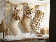 three christmas stockings hanging on the wall