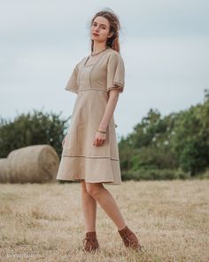 Harvest Dress We are currently waiting the arrival of a new production of this dress. Orders will be shipped after July 11th. This folk inspired dress is constructed of 100% cotton jute which has a beautiful traditional weave. The fabric is similar to linen and has a crisp solid feel. This dress is not dyed and the colours seen are the natural colours of the plant spun in to thread. Super comfortable to wear, perfect for summer days. It also makes a great layer over leggings for cooler days. Sma Beige Cotton Boho Dress For Summer, Beige Cotton Prairie Dress For Summer, Summer Beige Cotton Boho Dress, Summer Beige Boho Cotton Dress, Beige Short Sleeve Vintage Dress For Summer, Beige Vintage Short Sleeve Dress For Summer, Summer Cotton Peasant Prairie Dress, Summer Cotton Prairie Peasant Dress, Peasant Style Linen Dress For Spring