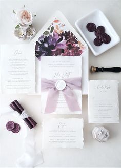 the wedding stationery is laid out and ready to be put into the bride's bouquet