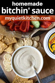 homemade bitchin'sauce in a white bowl surrounded by crackers and veggies