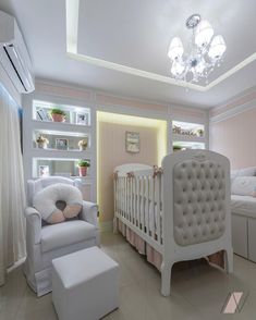 a baby's room is decorated in pink and white