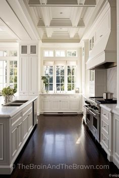 the kitchen is clean and ready for us to use it's white cabinetry