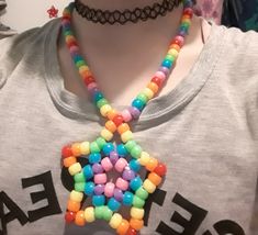 a person wearing a necklace made out of candy