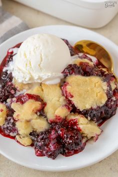 a white plate topped with fruit and ice cream