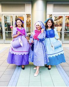 three women dressed in costume posing for a photo