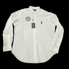 Ralph Lauren 2012 United States Olympic Team White 100% Cotton Long Sleeve Button Down Shirt Size 16 1/2 42 New With Tags, Excellent Condition Except A Very Faint Mark On Left Side Of Shirt See Photos. Measurements Flat Lay P2p 26” Length 23” From Shoulder To Hem Workwear Polo Collar Top With Buttons, White Casual Dress Shirt With Spread Collar, Casual Dress Shirt With Placket For Office, Casual Office Dress Shirt With Placket, White Casual Collar Top For Workwear, White Casual Collar Tops For Work, Casual White Collared Dress Shirt, Casual White Dress Shirt With Casual Collar, Classic Tops With Polo Collar And Buttons