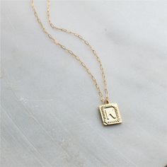 "Trendy and chic this necklace is made for everyday! Wear your favorite letter a rectangle pendant, perfect for a gift too! D E T A I L S -Gold plated rectangle initial pendant -14kt Gold filled shimmering drawn link necklace LENGTH - Please select from the drop down selection. - Choose a 16, 18 or 20 inch inch necklace length. - Standard Length is 18 inches - Pictured at 18\" in photos. C O M P L E T E ∙ T H E ∙ L O O K Styled with: Chunky Link Chain 16\" ∙ EXTRA LOVE ∙ Crafted and curated just Long Stone Necklace, Thick Chain Necklace, Custom Initial Necklace, Initial Necklaces, Gold Chain Choker, Rectangle Pendant, Pendant Necklace Gold, Initial Pendant Necklace, Personalized Gifts For Her