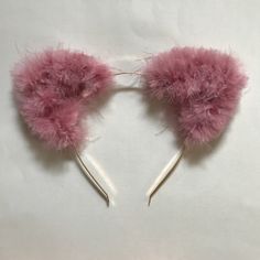 "These soft and fuzzy cat ears are perfect for your dress up needs! These are fun and feminine, perfect for any style. I have used a blush colored feather boa for the ears, which are created with brass wire. The ears are attached to a slim gold metal headband, standard size.  The ears measure about 2.5\" at the base and in height. The slim headband is a standard size, measuring 3mm in width.  Please contact me for any questions! :)" Pink Cat Ears, Fuzzy Cat, Cat Headband, Coloured Feathers, Cat Ears Headband, Comfortable Headbands, Rose Blush, Metal Headbands, Ears Headband