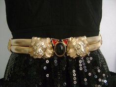 "Striking Runway Piece !... Vintage High-End Designer by JUDITH LEIBER Circa 80's-90's Roar Wild 4 Lion's Tiger Head-Face With Red & Black Semi Precious Stones Cabs/Glass Double-Strand Omega Chain Elasticized Belt Buckle 27-32\" Size S-M Heavy High Quality Piece Weight 333.7 Grams!! Shiny gold tone double-strand snake or omega chain type throughout, Decorated with 4 striking lion's heads/face 2 in the front and 1 on each side. The buckle accented with three red and black stones/cabs in the c Tiger Head, Judith Leiber, Cat Jewelry, Suspender Belt, Semi Precious Stones, Black Stone, Belt Buckle, Gold Tone Metal, Belt Buckles