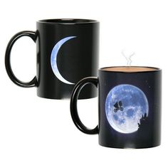 two black coffee mugs with the moon and stars on them in front of a white background