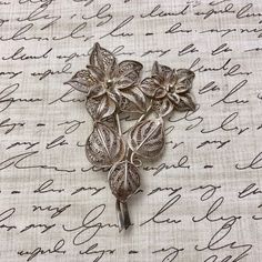 "Quantity: 1 Unit - (Sold Individually) Dimensions: 2.5\" (65mm) - Height 1.8\" (47mm) - Width" Antique Flower Brooches For Wedding, Vintage Filigree Flower Brooches, Vintage Silver Flower Brooches, Ornate Flower Brooch For Wedding, Ornate Flower Brooches For Wedding, Formal Filigree Flower Brooches, Ornate Flower Shaped Wedding Brooches, Ornate Flower Brooches For Formal Occasions, Vintage Silver Flower Pins