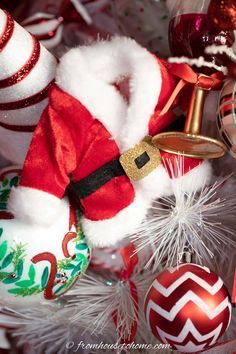 a christmas tree with ornaments and decorations on it, including santa claus's hat