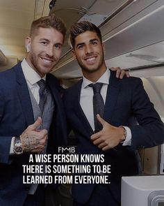 two men in suits posing for the camera on an airplane with text that reads, a wise person knows there is something to be learned from everyone