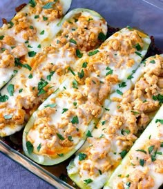 stuffed zucchini boats with meat and cheese in a casserole dish