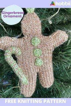 a knitted gingerbread ornament hanging on a christmas tree with the text free knitting pattern