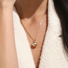 An icy crystal breaks forth in a laser-cut bezel on this innovative necklace, giving it an ambiance of effortless style. This artistic bubble sphere pendant sits on a dainty bail with a sturdy chain threaded through, making it ready to wear. Layer this versatile necklace with other chains if desired.

Length: 18.5in
Width: 2mm
Stone Color:Shiny White
Pendant Size：13x13mm
Material: Crystals, 18k Gold Plated On Brass Gold Crystal Necklace With Round Shape, Crystal Clavicle Chain Necklace With Round Pendant, Crystal Round Pendant Necklace, Crystal Round Pendant Necklace With Adjustable Chain, Crystal Necklace With Round Pendant And Adjustable Chain, Crystal Round Pendant Necklace For Gift, Effortless Style, Stone Color, Laser Cut