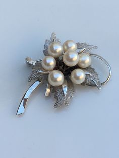 Beautiful sterling pearl bouquet brooch hallmarked silver circa 1960's. This is a beautiful brooch in silver holding the authentic pearls with such great shiny luster. Formal Silver Pearl Brooch, Silver Pearl Brooch For Anniversary, Pearl Bouquet, Bouquet Brooch, Brooch Bouquets, Designer Fashion Jewelry, Hallmark, Brooch Pin, Brooches