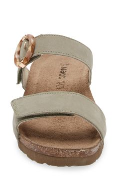 A rounded buckle stands out at the strap of a summery sandal set on a walkable wedge for everyday comfort and style. 1 1/4" heel (size 39) Adjustable hook-and-loop straps Cushioned footbed with arch support Leather upper and lining/synthetic sole Imported Casual Adjustable Wedge Heel Footbed Sandals, Everyday Slingback Sandals With Round Toe, Everyday Slingback Sandals With Adjustable Strap And Round Toe, Wedge Sandals With Adjustable Strap And Round Toe, Everyday Ankle Strap Sandals With Buckle Closure, Cushioned Footbed Sandals With Round Toe For Everyday Use, Open Toe Footbed Sandals For Everyday Summer Use, Cushioned Footbed Sandals For Everyday Use, Everyday Open Toe Footbed Sandals For Summer