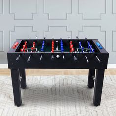 a foosball table is shown with several different items on it, including toothbrushes and screwdrivers