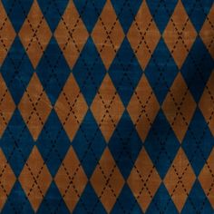 a blue and brown area rug with an argyle pattern