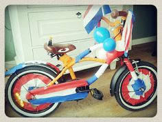 an inflatable bike with balloons attached to the front wheel and seat is shown