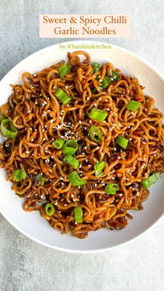 sweet and spicy chili garlic noodles in a white bowl