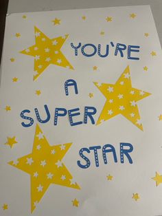 you're a super star card with yellow and blue stars on white paper that says, you're a super star