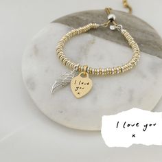 Our sterling silver and yellow gold vermeil memorial bracelet is at the heart of our special jewellery collection designed to commemorate cherished memories. Our beautiful range of engraved silver jewellery makes a touching memorial keepsake, presented on your choice of six elegant quote cards: With Love Thinking Of You Your Wings Were Ready But My Heart Was Not Forever In My Heart Fly With The Angels, Dance With The Stars Or a fresh white, plain quote card. This elegant sterling silver and yell Yellow Gold Sterling Silver Heart Bracelet For Anniversary, Engraved Yellow Gold Charm Bracelet For Anniversary, Yellow Gold Charm Bracelet For Anniversary And Mother's Day, Anniversary Engraved Yellow Gold Charm Bracelet, Mother's Day Gold Sterling Silver Charm Bracelet, Mother's Day Gold-toned Charm Bracelet, Sterling Silver Gold Charm Bracelet For Valentine's Day, Carton Texture, Elegance Quotes