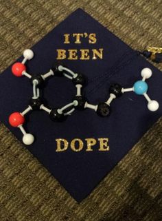 a graduation cap with the words it's been dope on it and some beads