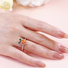 Let's keep it real, every girl wants a couple of carats on her finger. That's 'carats' though, not 'carrots'. Jewelry designer has combination the carrot with a pear-cut center stone, the ring is designed to shine from every angle. The glittering centerpiece is complete with a halo of small round stones and shimmering stone-set shoulders, which enhance the brilliance of this chic design.Carat Weight: 1.82 ctStone Size: 6*8 mmStone Type: Jeulia® StoneNumber of Stones: 1 Stone Shape: PearStone Col Orange Diamond Ring As Gift, Orange Diamond Ring As A Gift, Gift Orange Diamond Ring, Keep It Real, Jewelry Designer, Pear Cut, Every Girl, Stone Settings, Chic Design