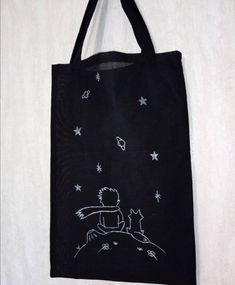 a black tote bag with white stars on it