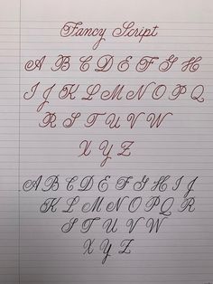 the writing is lined up with different types of cursive letters and numbers in red ink