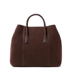 Practical and stylish, this mini weekender bag is ideal for an overnight getaway or for times when a roomy handbag is required on a busy day. Expertly made to the highest standards in Florence, Italy, it has shoulder straps or a longer detachable strap can be used for ease of transport. Suede Inside pocket Dimensions: 13.6"l x 6.7"w x 11.4"h Comes in a protective dust bag Made in Italy Care instructions: Only clean with a dry brush or dry cloth | AERIN Suede Mini Weekender in Chocolate/Brown siz High-end Tote Box Bag For Travel, Luxury Travel Box Bag With Handles, Luxury Satchel Tote For On-the-go, Luxury Satchel With Rolled Handles For On-the-go, Elegant Brown Weekender Bag For On-the-go, Luxury Everyday Satchel With Rolled Handles, Luxury Satchel With Rolled Handles For Everyday, Elegant Duffle Bag With Double Handle, Luxury Double Handle Duffle Bag For Shopping