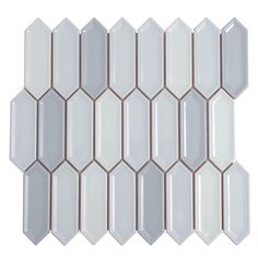 white and brown glass mosaic tile with hexagonal pattern on the bottom, in an angled