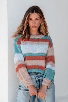 Expertly crafted for style and comfort, the Fresh Start Multi Striped Sweater is the perfect addition to any fall wardrobe! With its long sleeves, round neckline, and striped pattern, this sweater is effortlessly chic. Plus, the side slits and slightly oversized fit provide a flattering silhouette. Style with jeans, ankle booties, and a matching crossbody bag for an elevated boho chic look! Chic Striped Crew Neck Sweater, Striped Soft Knit Sweater For Fall, Fall Striped Soft Knit Sweater, Striped Sweater For Layering In Fall, Soft Knit Striped Sweater For Fall, Trendy Striped Sweater For Fall, Knit Crew Neck Sweater With Horizontal Stripes, Knit Sweater With Horizontal Stripes And Crew Neck, Striped Long Sleeve Soft Knit Sweater