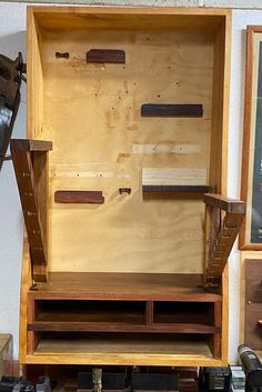 a wooden shelf with some tools on it