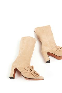 Our sand Greta boots are handcrafted in Portugal from buttery soft suede. Designed to a sculptural silhouette, this style features Vandrélaar's unique hand-finished detailing on a refined square toe. The curved block heel sits at a comfortable everyday height of 8cm, and the boots are finished with a sleek silver zip at the back ankle. Pair them with cropped jeans or midline skirts for an effortless look. Navy Linen, Sand Beige, Black Linen, Powder Blue, Vegetable Tanned Leather, Soft Suede, Brown Suede, Cropped Jeans, Mule Shoe