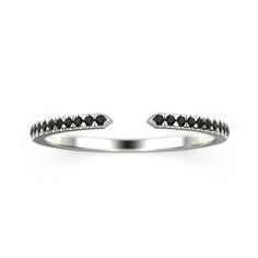 a white gold ring with black diamonds