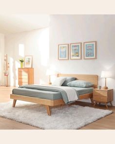 a bed room with a neatly made bed and two nightstands next to each other