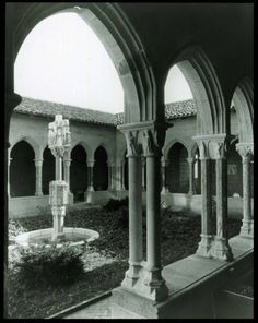 an old black and white photo of a courtyard