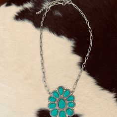 Boast your boho style with The Okley Necklace! Crafted with a turquoise blossom and shimmery chain, this beauty will have 'em doin' a double-take! So go ahead, flaunt it — you're sure to make a statement wherever you go! (And when the compliments come, graciously accept 'em, okley-dokley?) length: 11" extended chain: 3" Bohemian Turquoise Flower Pendant Necklace, Bohemian Jewelry With Flower Pendant And Adjustable Chain, Adjustable Turquoise Flower Pendant Jewelry, Double Take, Go Ahead, Boho Style, Boho Fashion, Blossom, Necklaces